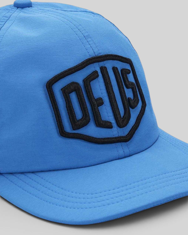 Baffle Haus Shield Nylon Cap in Bonnie Blue with a black twill patch logo on the front