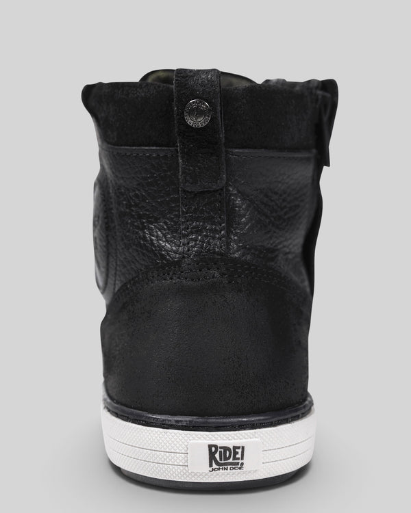 Baffle Haus Shifter black leather motorcycle sneaker boot, rear view showing heel reinforcement and white sole.