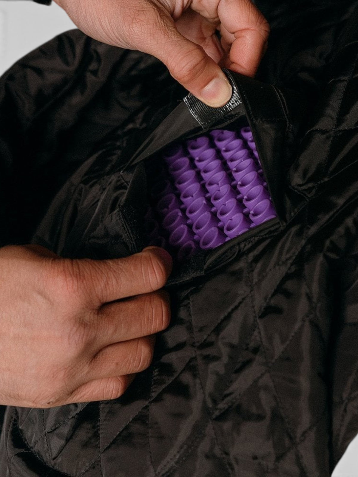 Baffle Haus Shōgun leather jacket interior showing the purple RE ZRO Level 2 protective armour in a quilted pocket.