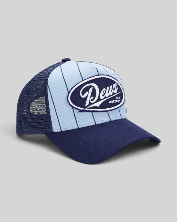Baffle Haus Forecourt Trucker hat in sky blue and navy cotton twill with pinstripes and Deus Customs patch