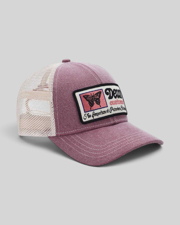 Baffle Haus Slapstick Trucker hat in melon red with a white mesh back, unstructured crown, and butterfly patch.