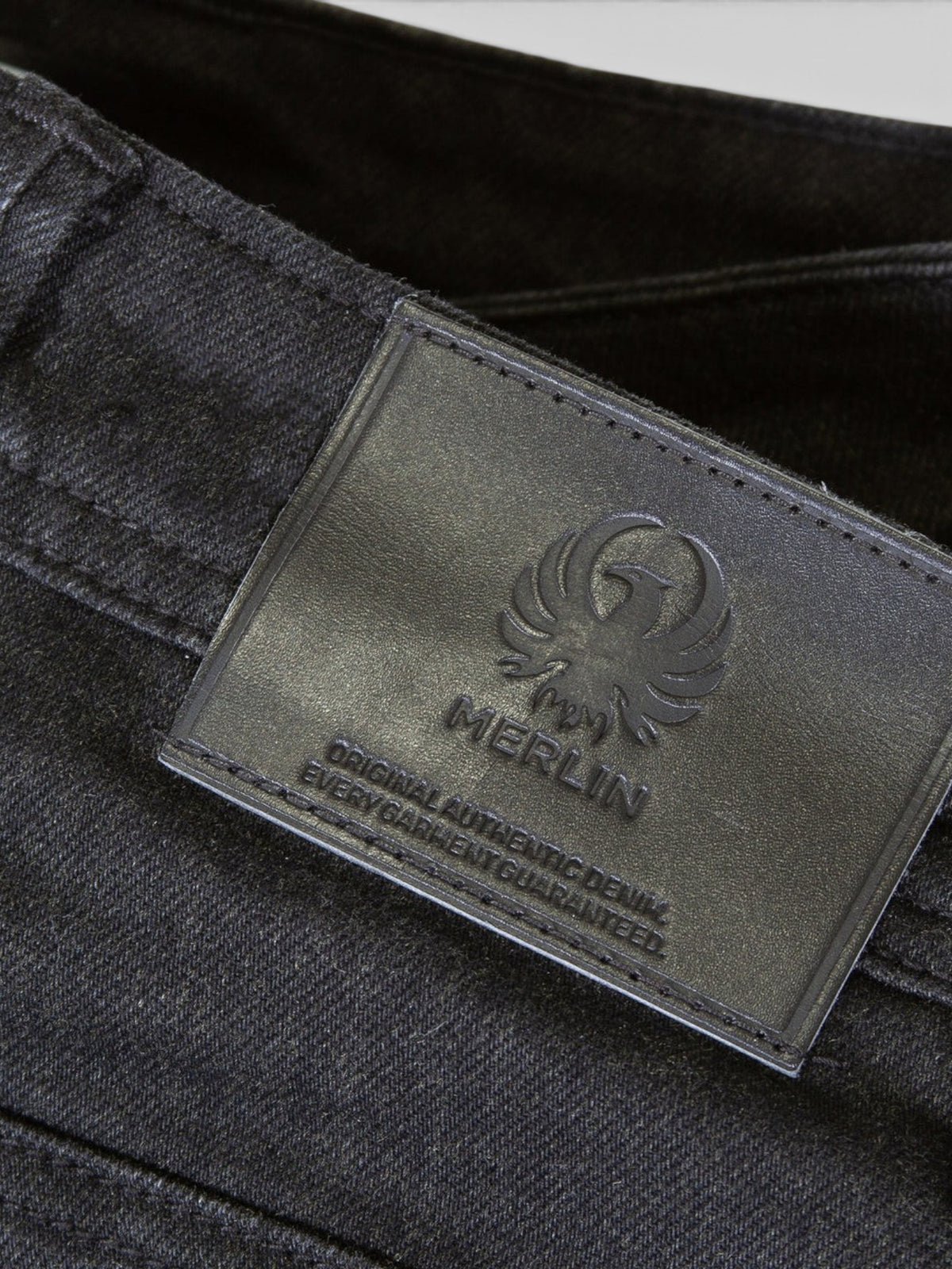 Baffle Haus Soho ladies black motorcycle jeans featuring a branded leather belt patch and durable denim construction.
