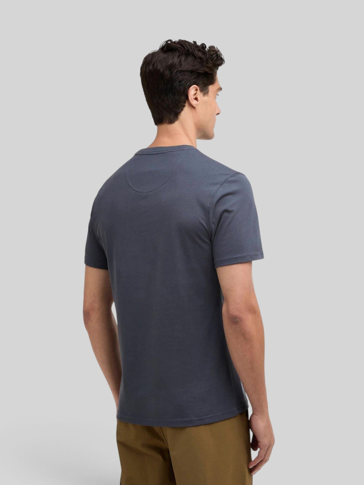 Baffle Haus storm grey cotton crew neck t-shirt worn by a man, back view showing tailored fit and short sleeves