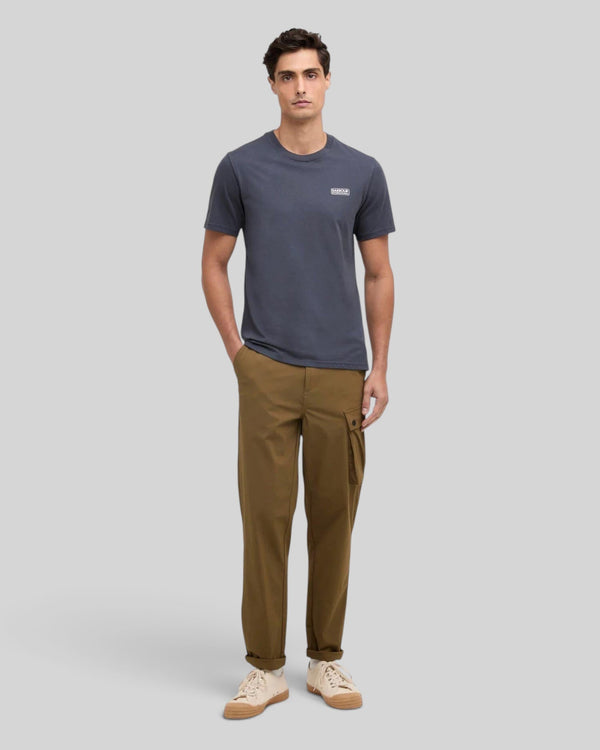 Baffle Haus storm grey cotton crew neck t-shirt with small chest logo worn by a male model with brown cargo pants