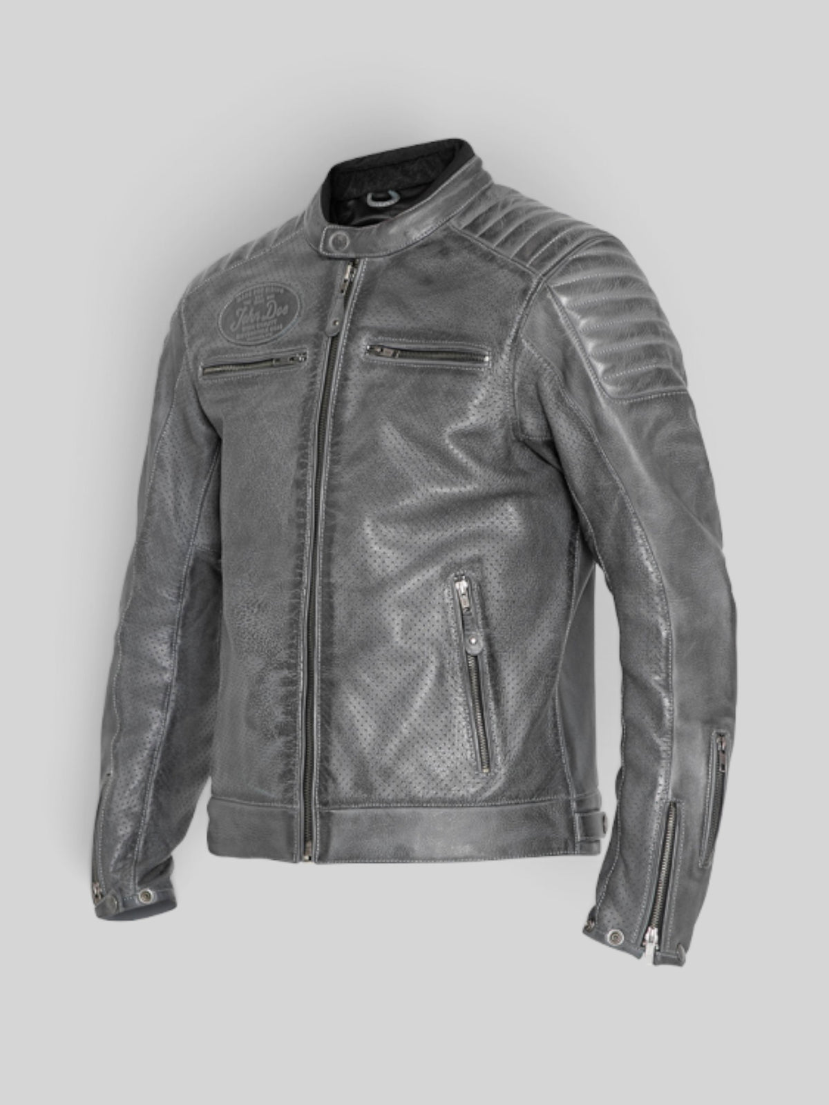 Baffle Haus Storm grey perforated leather motorcycle jacket with padded shoulders, zippered pockets, and snap collar.