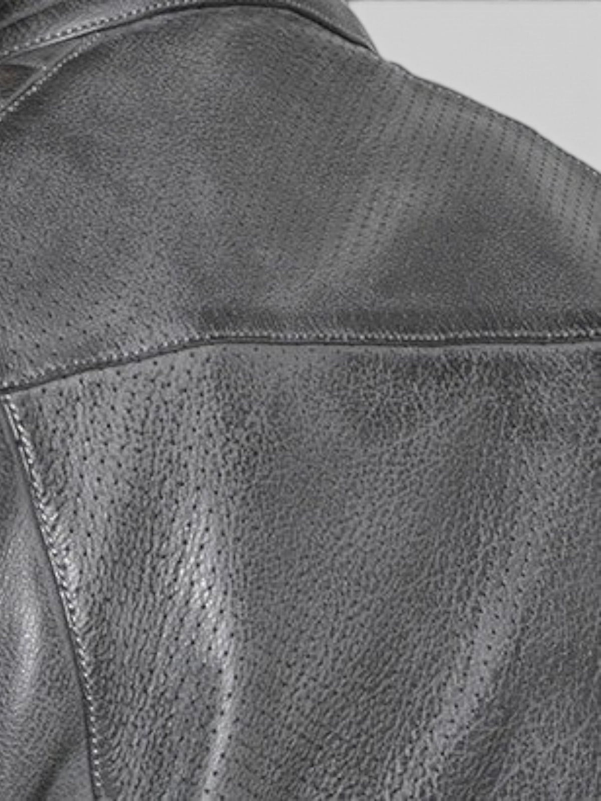 Close-up of Baffle Haus Storm grey perforated leather motorcycle jacket showing textured grain and stitching detail