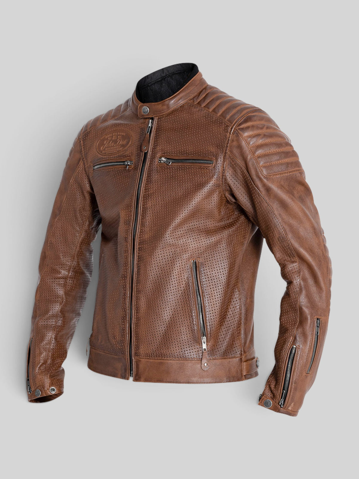 Baffle Haus Storm perforated tobacco leather motorcycle jacket with padded shoulders and YKK zipper details.