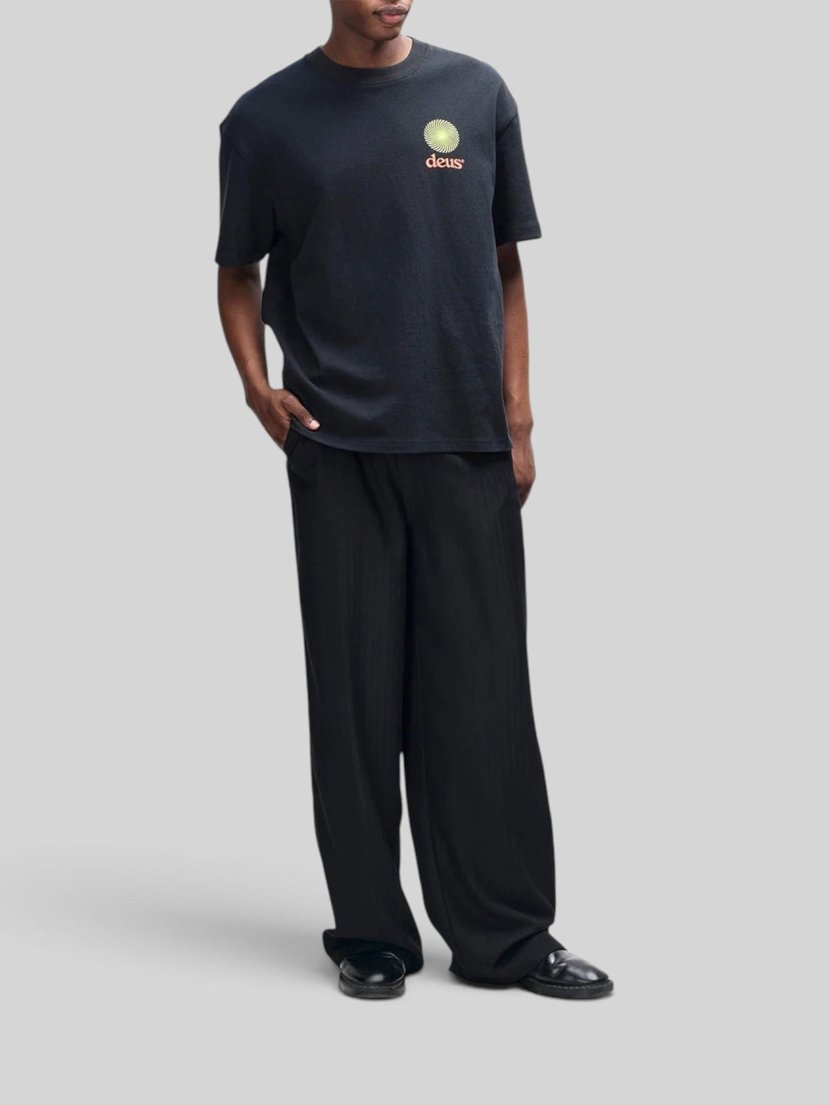 Baffle Haus Strata Tee in black recycled cotton with an oversized fit and graphic logo print on the chest