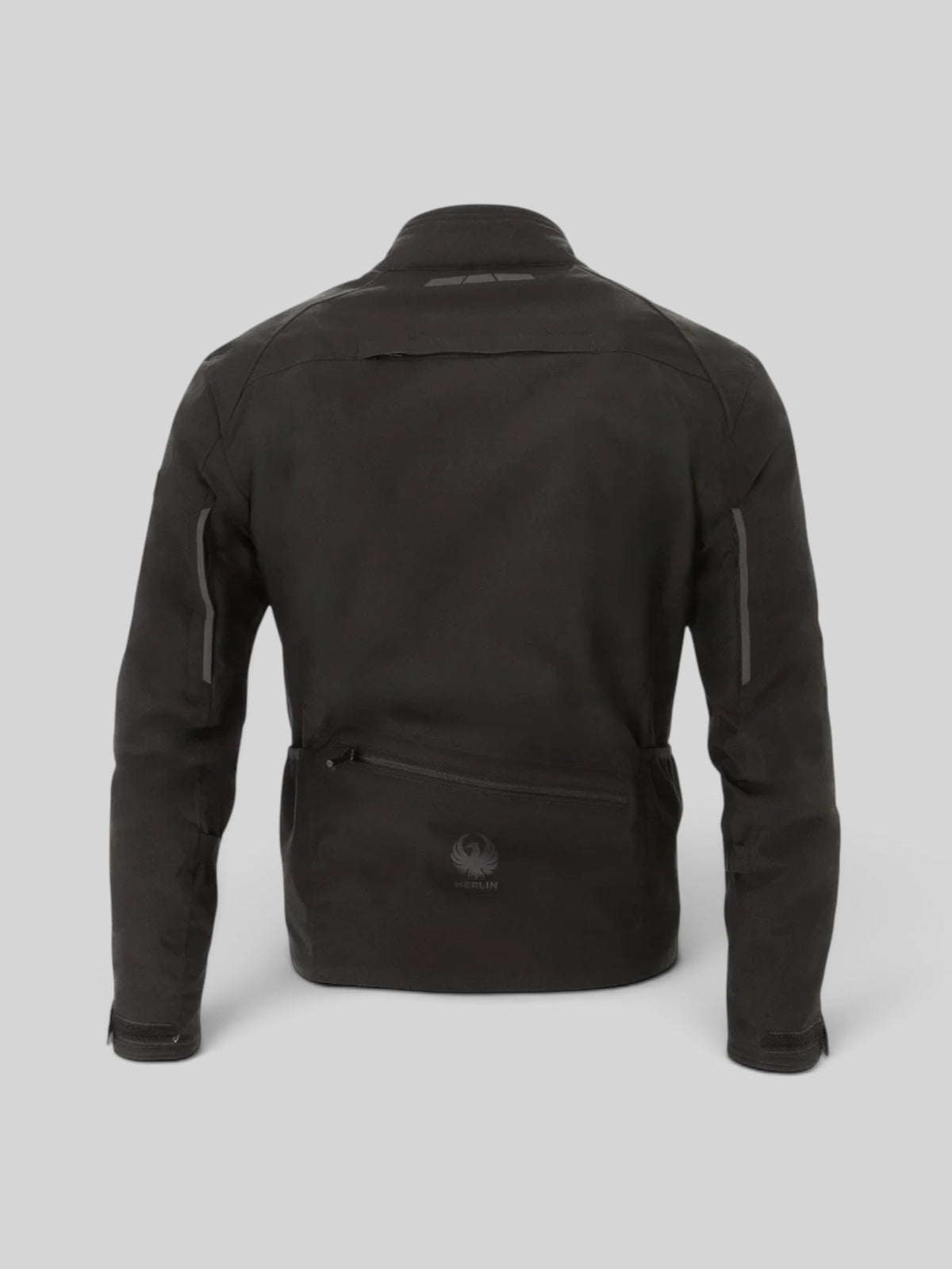 Baffle Haus Taos waterproof motorcycle jacket in black, back view showing rear storage pocket and reflective details.
