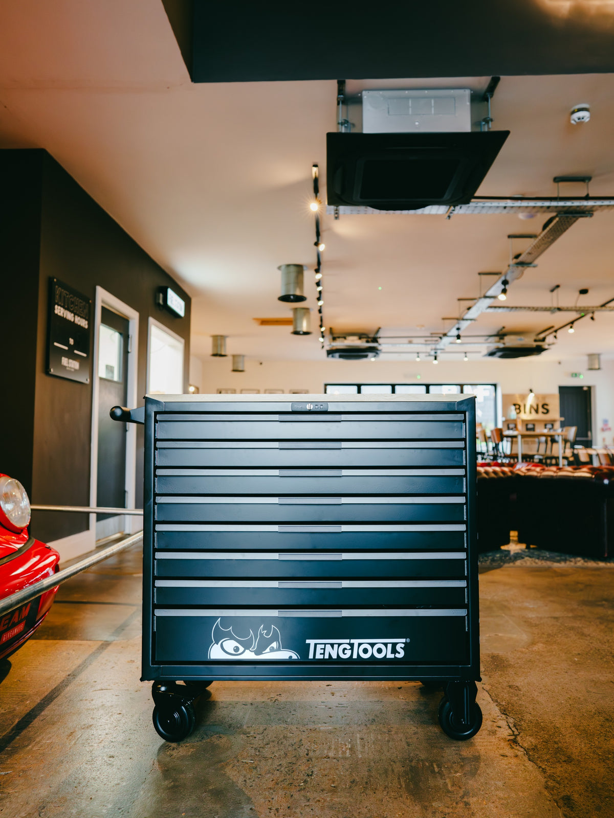 Baffle Haus Teng Tools black metal rolling tool cabinet with multiple drawers in a workshop setting