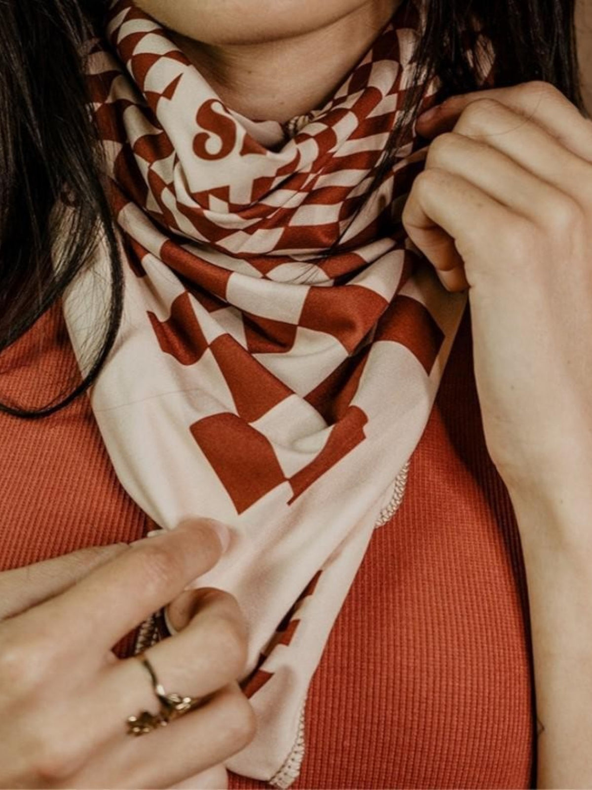 Baffle Haus Petrol Junkies scarf in terracotta and cream with a vintage 60s psychedelic checkerboard racing pattern.