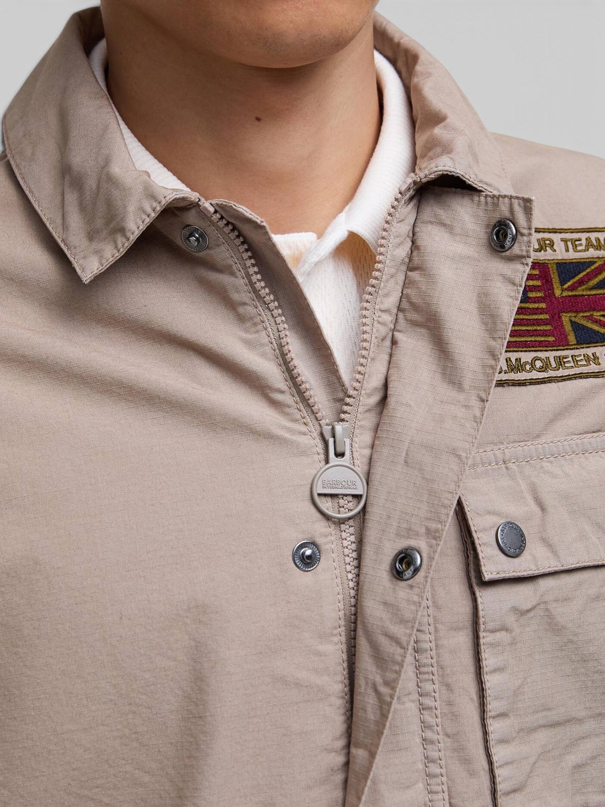 Baffle Haus Barbour International timberwolf casual jacket with zip, studded placket, and Steve McQueen chest patch.