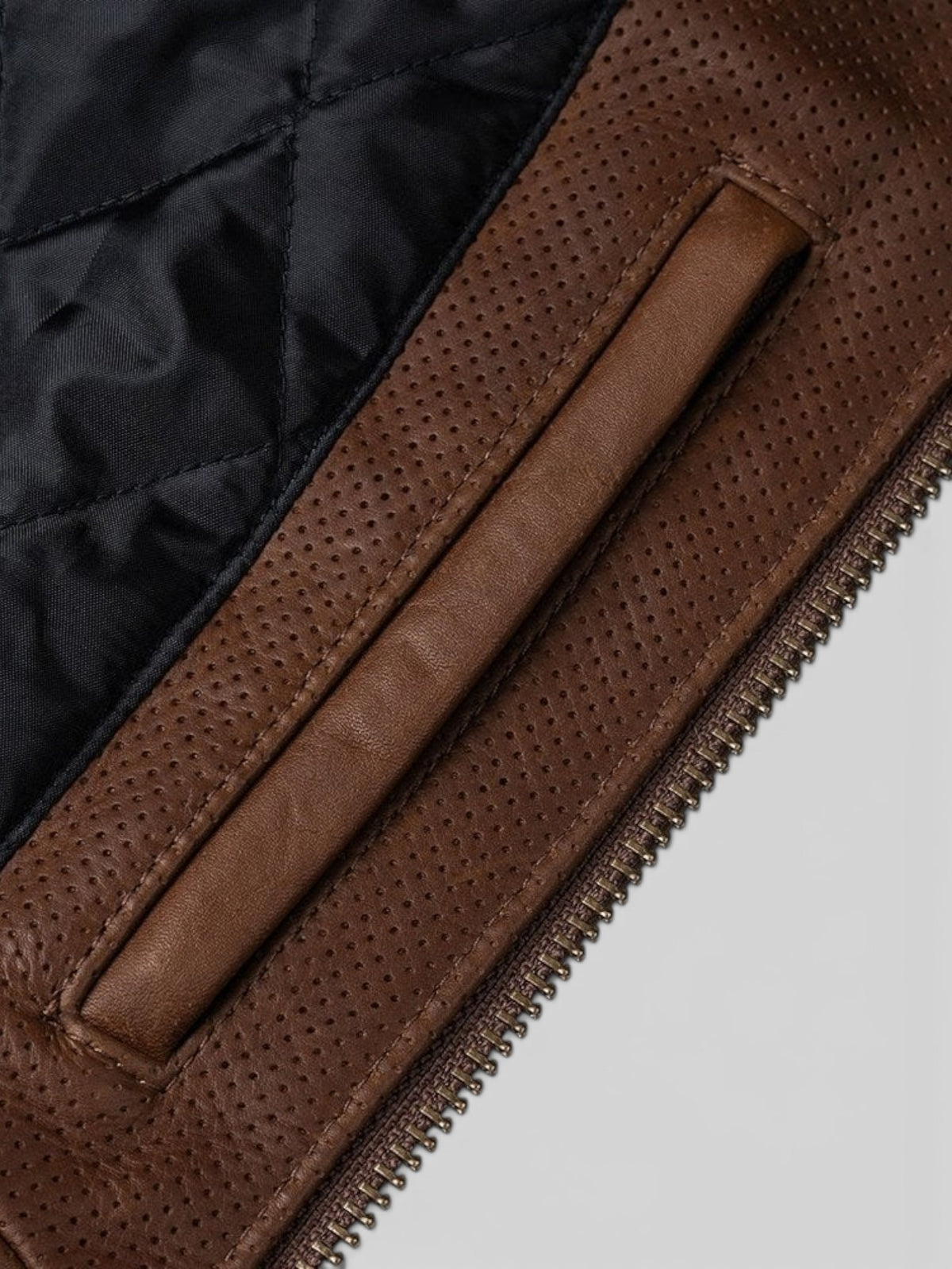 Baffle Haus Motone Revolver tobacco brown perforated leather riding jacket with quilted black lining and brass zipper