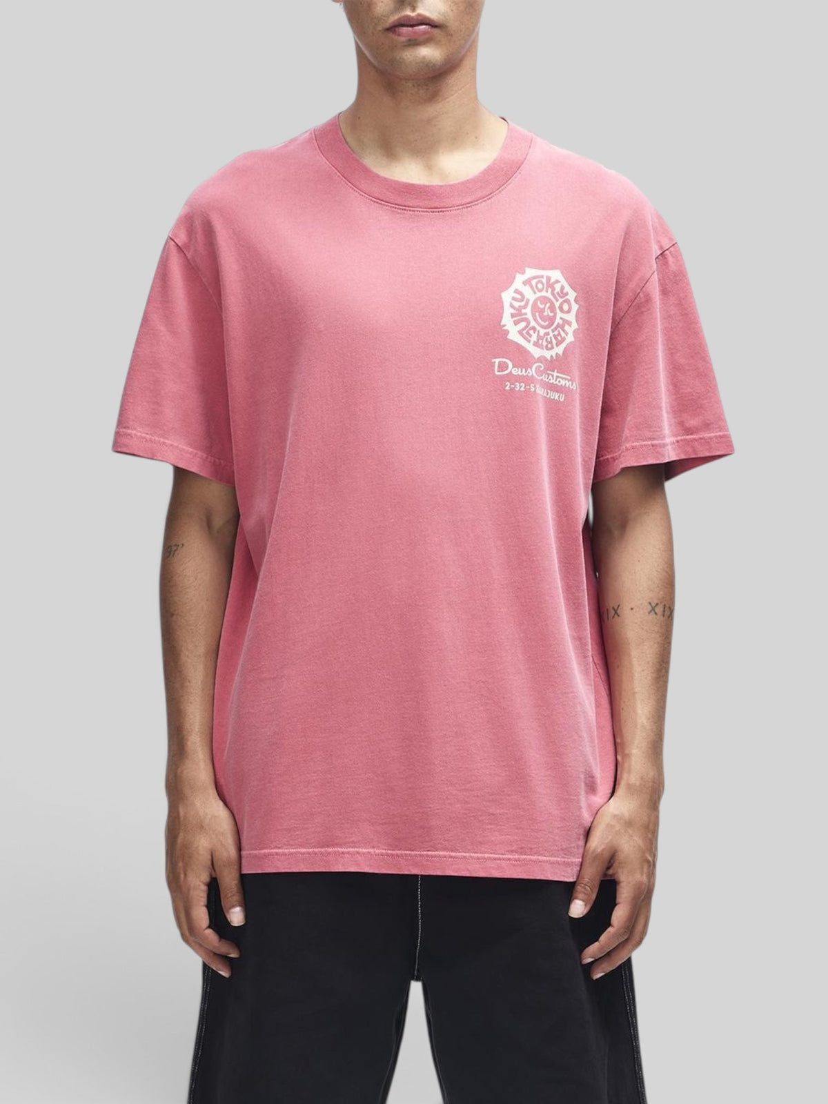 Baffle Haus Tokyo Address Tee in melon red recycled cotton with white graphic print on chest and loose fit
