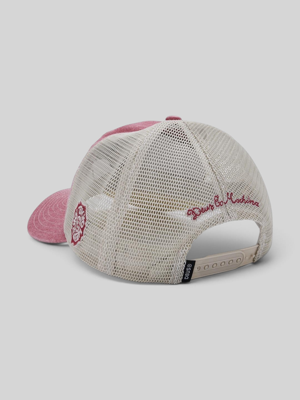 Baffle Haus Tokyo Address trucker hat in melon red with a beige mesh back, snap closure, and side embroidery.