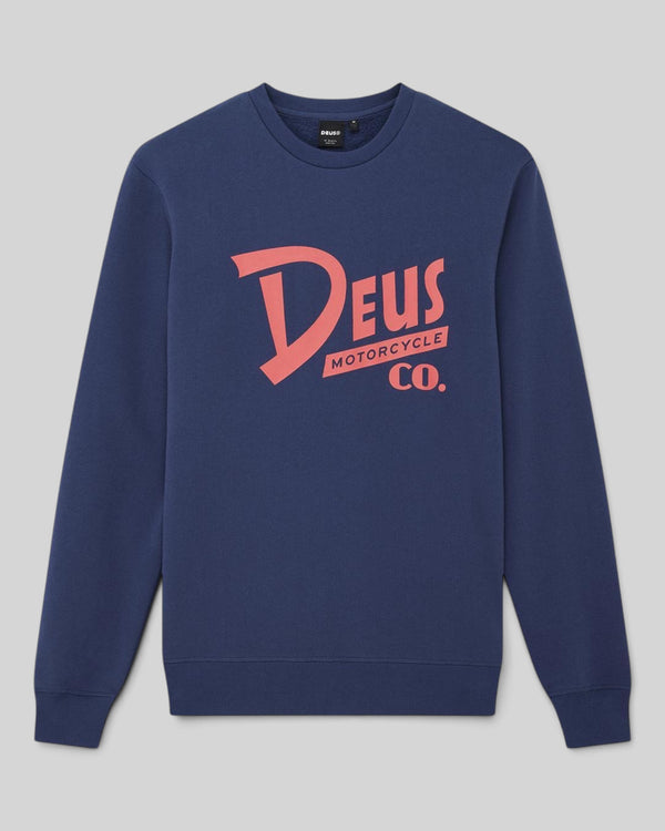 Baffle Haus Trafalgar crew neck fleece in mechanic blue with Deus Motorcycle Co. graphic print on the chest.