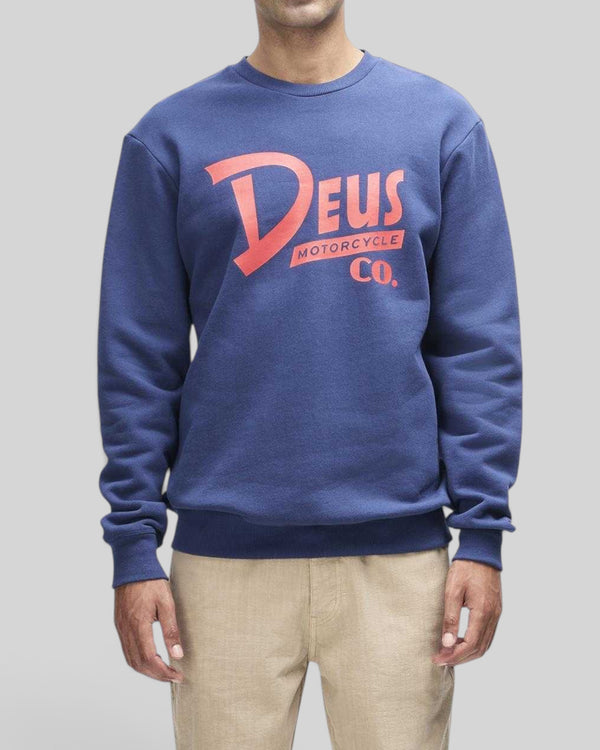 Baffle Haus Trafalgar crew fleece in mechanic blue organic cotton with red Deus motorcycle graphic on the chest