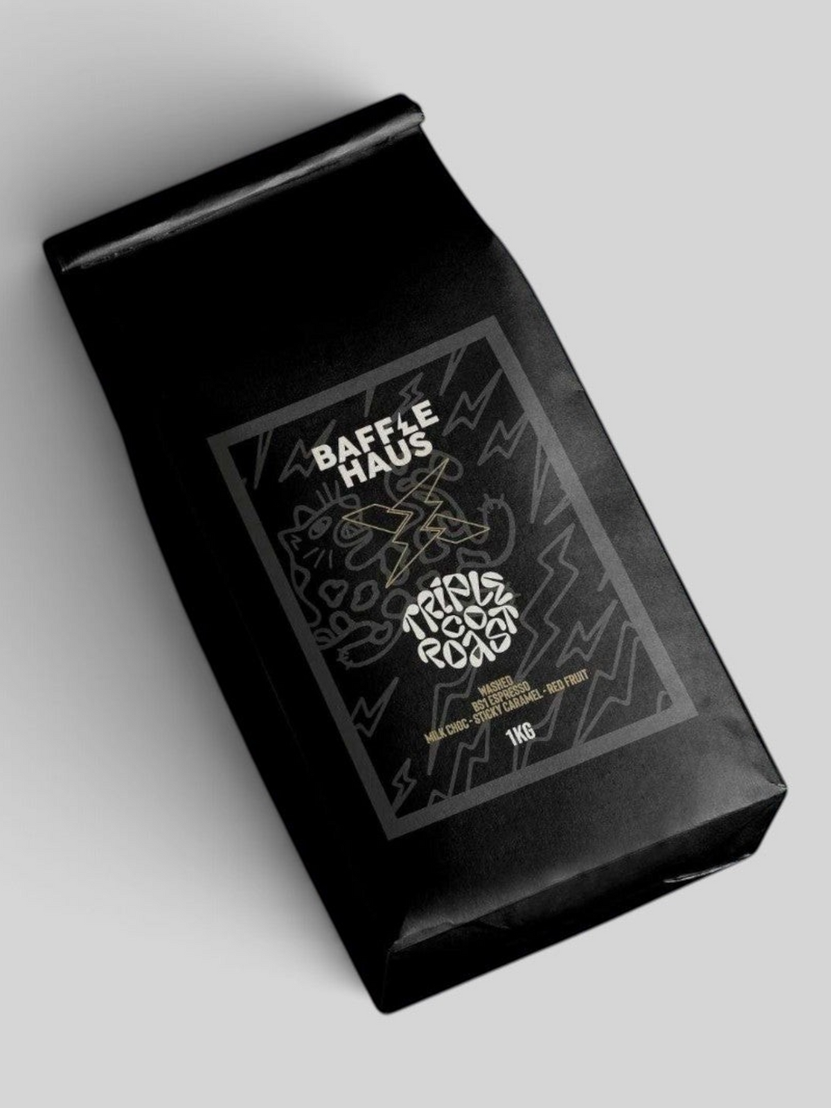 Baffle Haus 1kg bag of Triple Co single origin Colombian coffee beans in matte black packaging with graphic label.