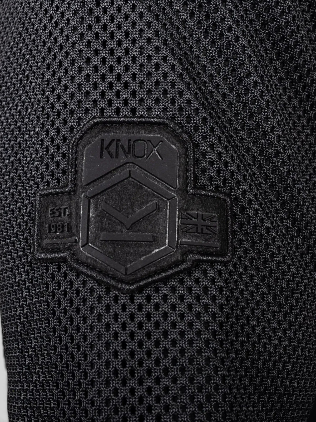 Baffle Haus Urbane Pro MK3 black motorcycle jacket featuring a detailed Knox branded rubber patch on mesh fabric