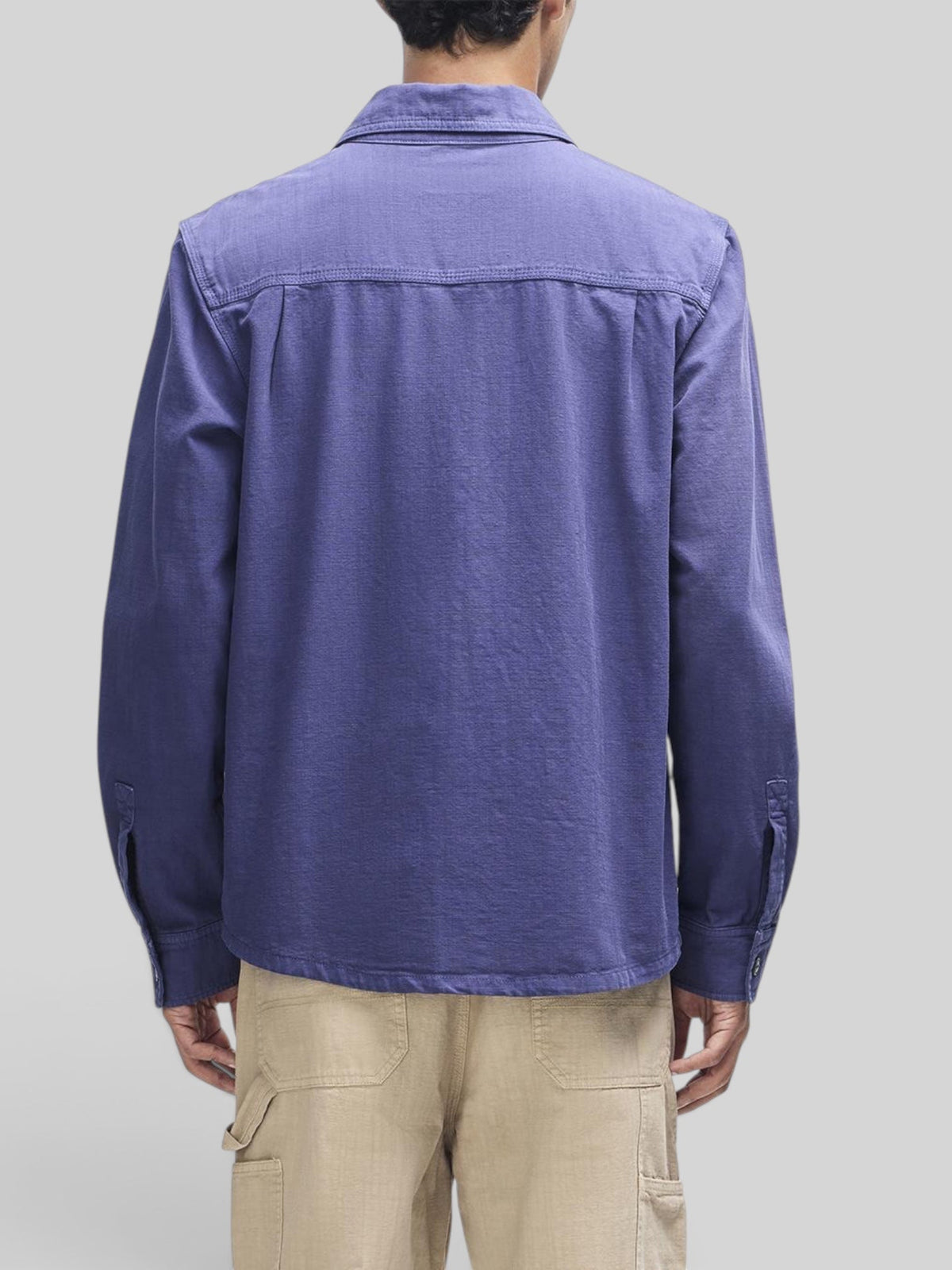 Back view of Baffle Haus Vacay Chambray Shirt in mechanic blue cotton with a relaxed fit and long sleeves.