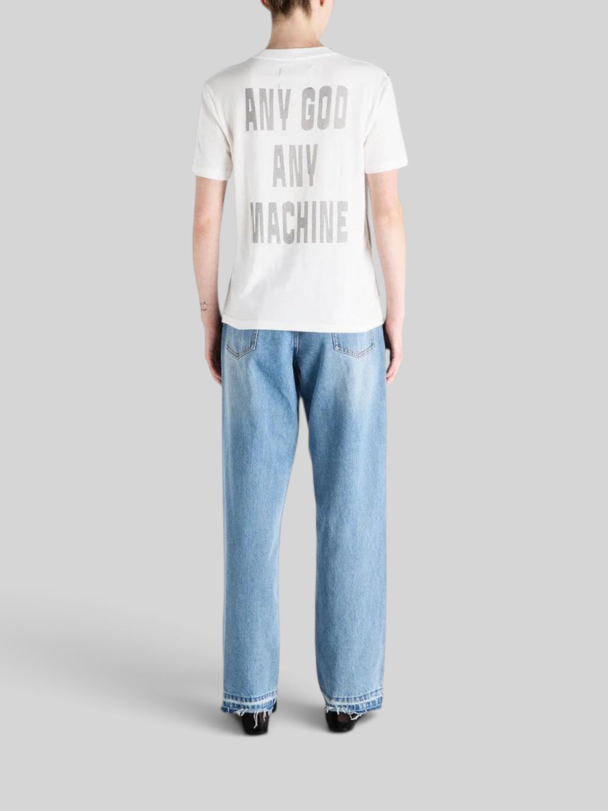 Baffle Haus vintage white cotton t-shirt with Any God Any Machine back print worn with blue denim jeans