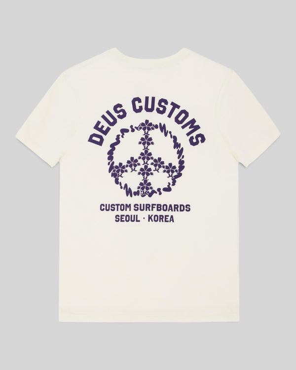 Baffle Haus vintage white organic cotton t-shirt with purple Deus Customs peace sign graphic on the back