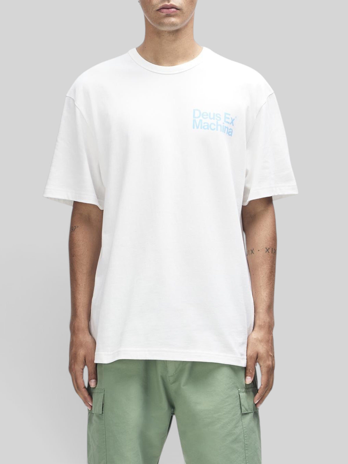 Baffle Haus Plenty Good Tee in vintage white, regular fit short sleeve shirt with blue chest graphic on model