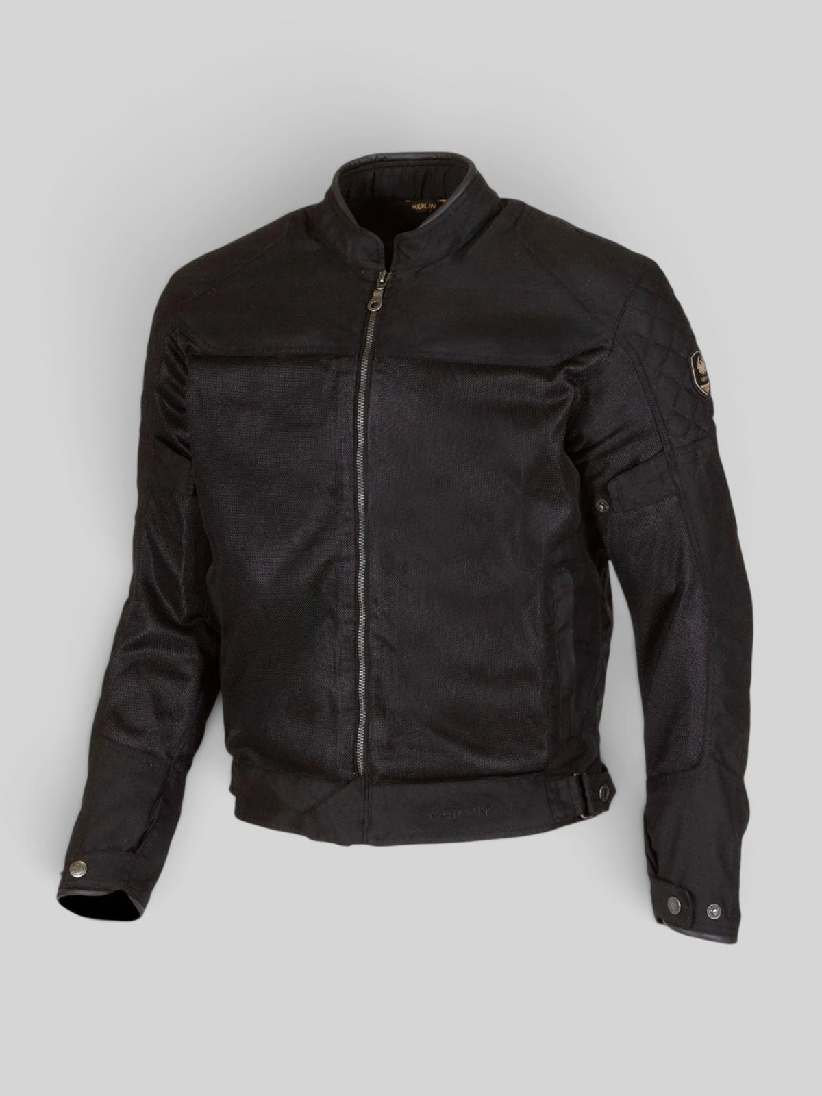 Baffle Haus Waltham black motorcycle jacket featuring breathable mesh panels, waxed cotton, and quilted shoulders.