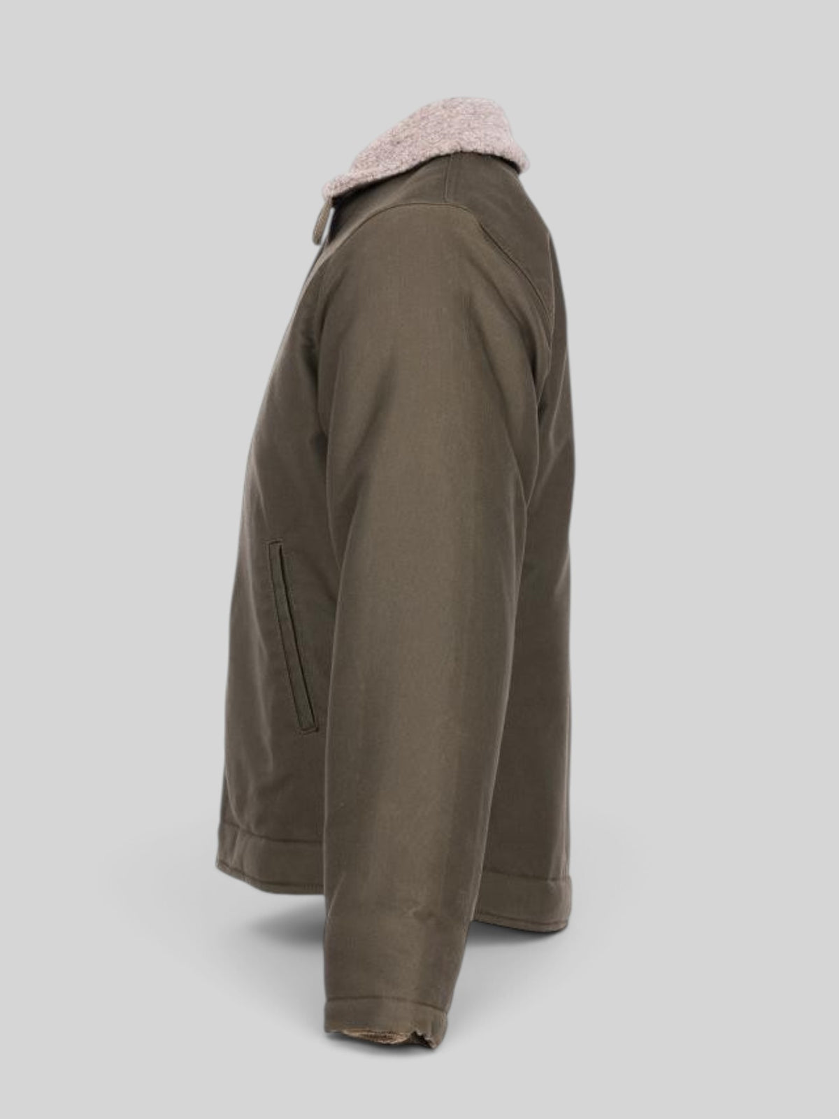 Baffle Haus 1944 N1 Deck Jacket in waxed olive cotton with a wool-lined collar, shown from a side profile view.