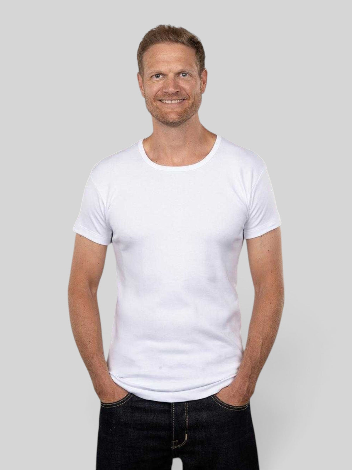 Baffle Haus 1947 round neck white heavyweight cotton t-shirt worn by a man in a slim fit style