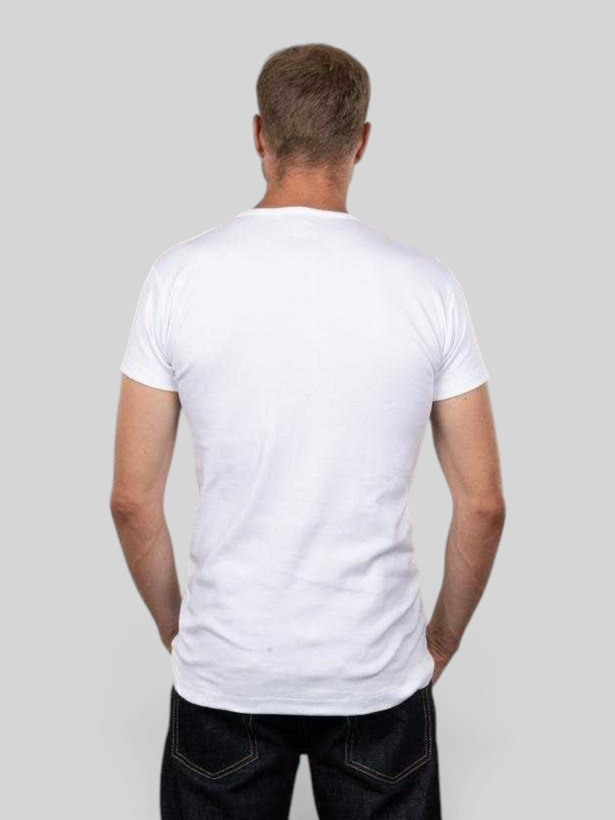 Back view of a man wearing a Baffle Haus white heavyweight cotton tubular knit slim fit t-shirt