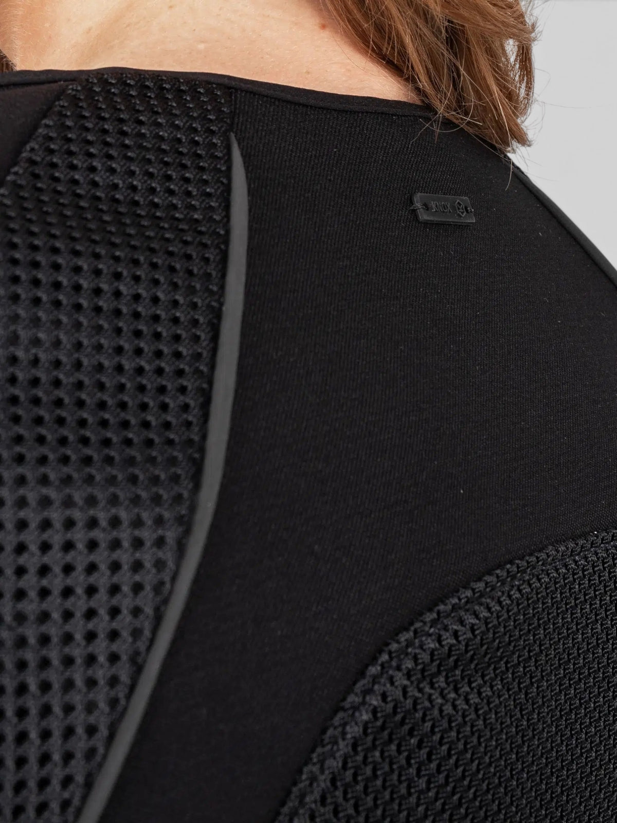 Baffle Haus Womens Urbane Pro MK3 motorcycle jacket in black featuring breathable mesh panels and reflective piping.