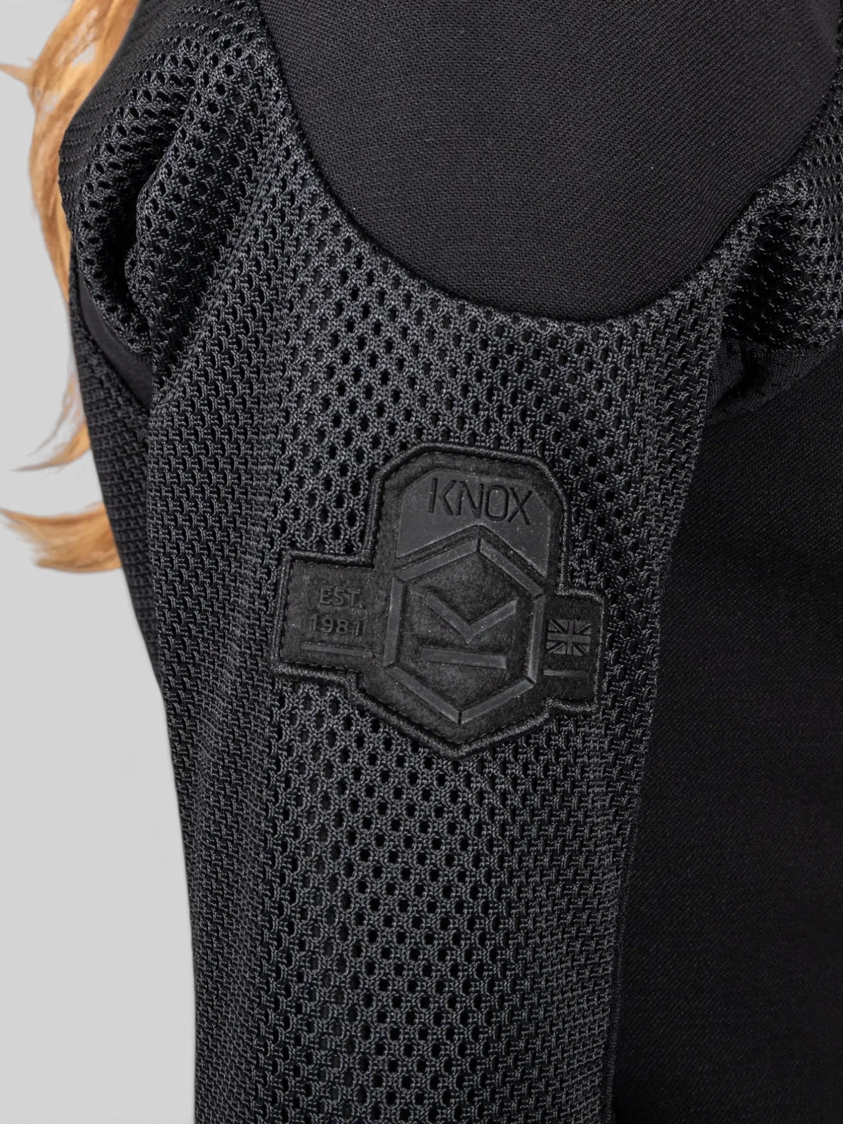 Baffle Haus Womens Urbane Pro MK3 motorcycle jacket sleeve featuring black technical mesh and embossed Knox logo