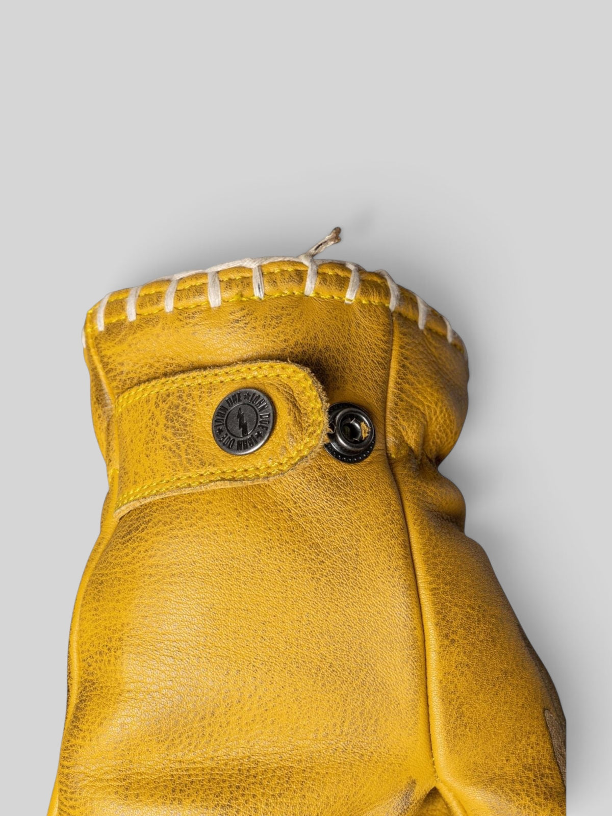 Baffle Haus yellow cowhide leather motorcycle gloves with adjustable press-stud cuff and stitched detailing