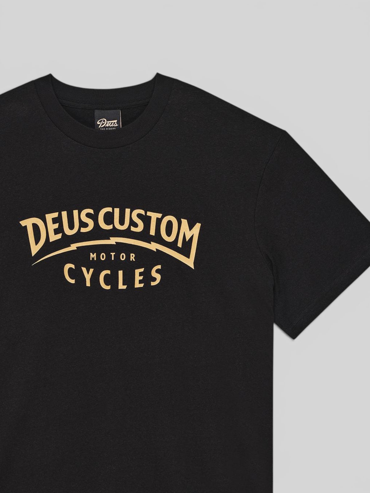 Baffle Haus Yesyes Tee in black featuring a vintage-style gold graphic print on the chest