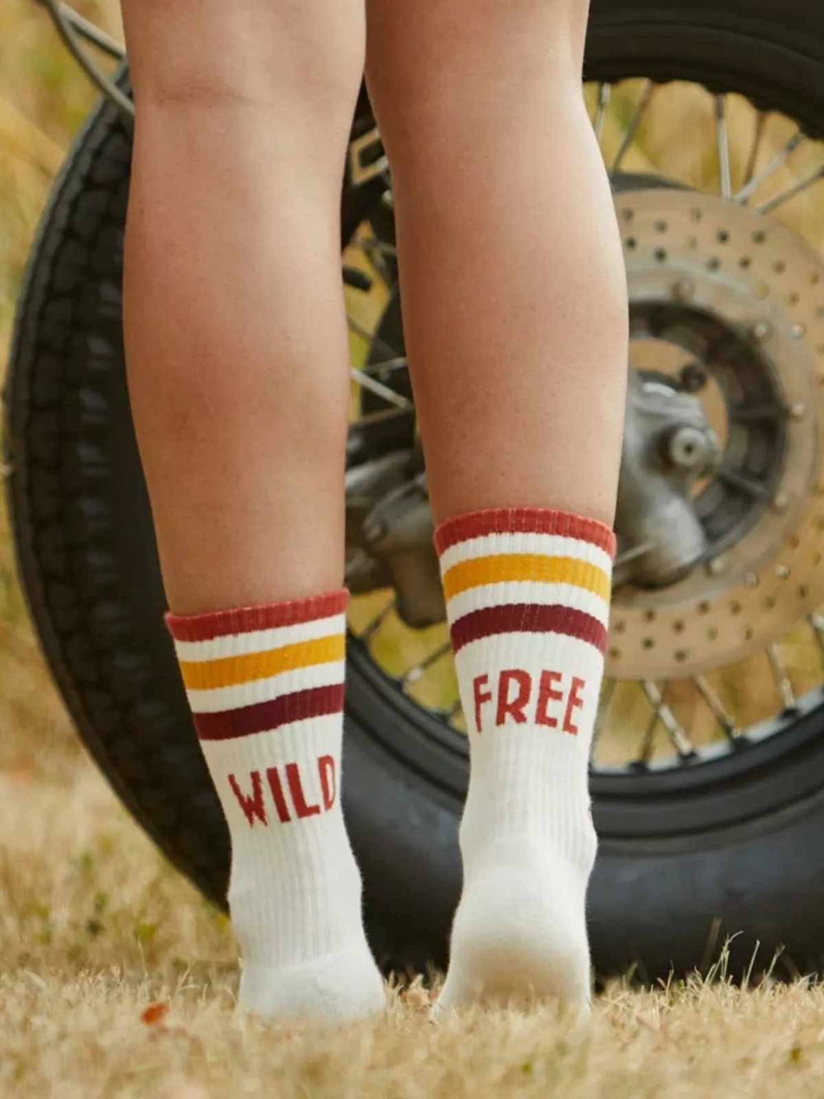 Baffle Haus cream mid-calf sports socks with retro 70s style stripes and Wild Free text on the back
