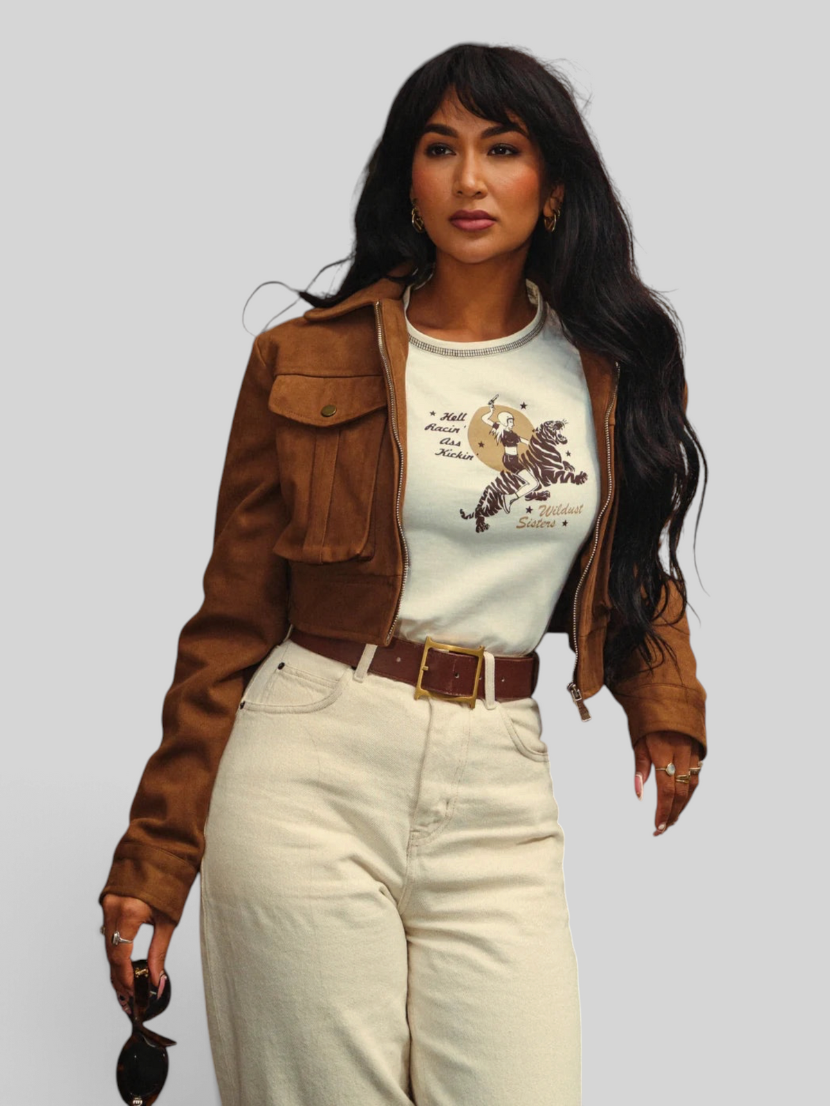 Baffle Haus white cropped cotton t-shirt with tiger rider graphic print worn under a brown suede jacket