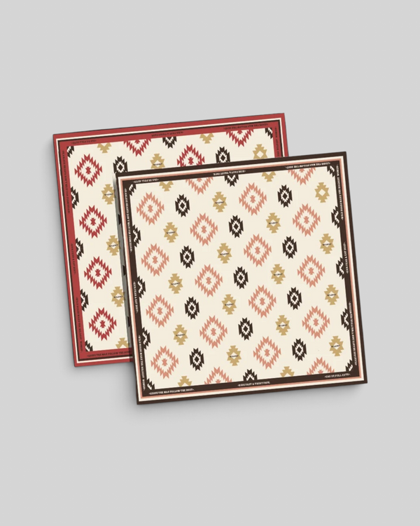 Baffle Haus Apache motorcycle scarf featuring a geometric western print in beige, terracotta, and brown Lycra fabric.
