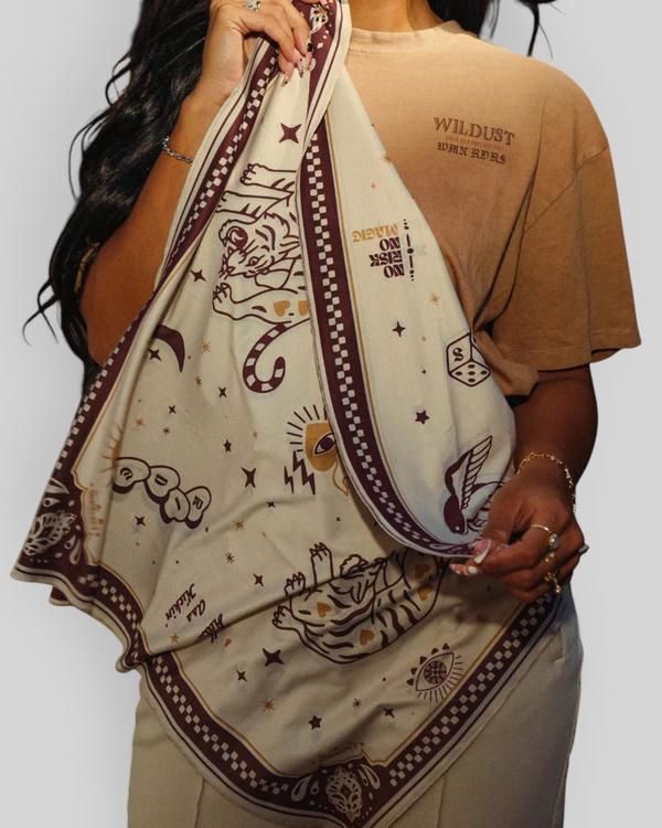 Baffle Haus Moon Rider beige lycra motorcycle scarf with brown tiger and celestial tattoo-style prints.