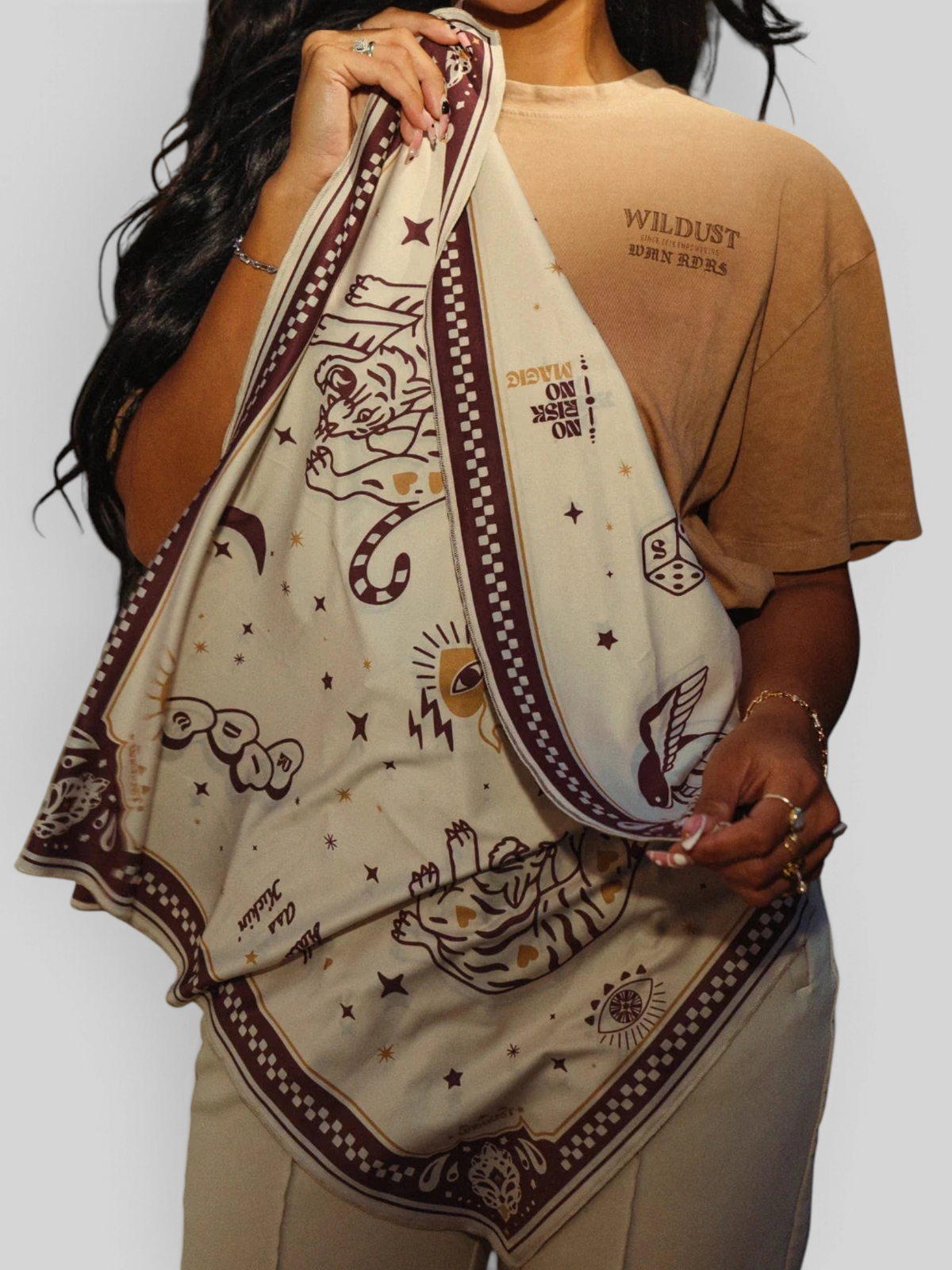 Baffle Haus Moon Rider beige lycra motorcycle scarf with brown tiger and celestial tattoo-style prints.