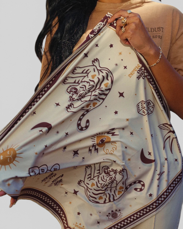 Baffle Haus Moon Rider scarf in beige lycra with brown tiger, celestial, and tattoo-inspired graphic prints