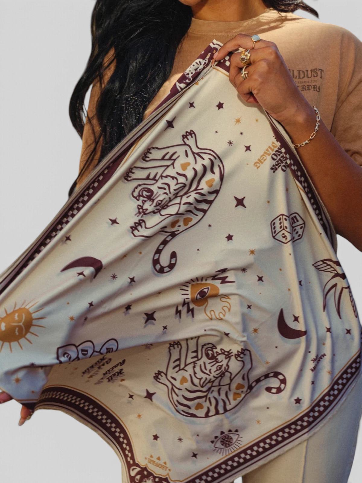 Baffle Haus Moon Rider scarf in beige lycra with brown tiger, celestial, and tattoo-inspired graphic prints
