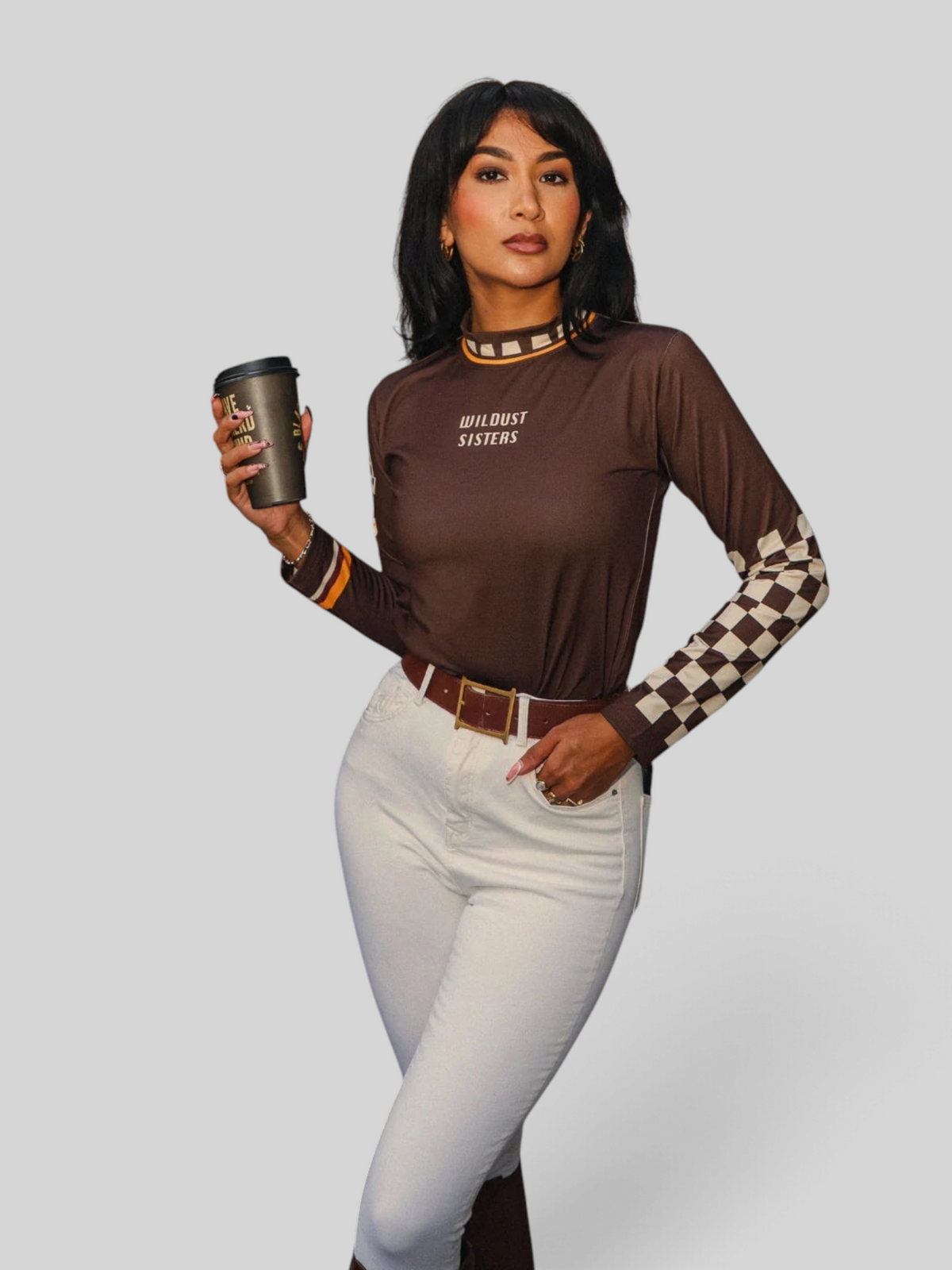 Baffle Haus brown long sleeve Lycra top with vintage racing checkerboard pattern on sleeves and Wildust Sisters print