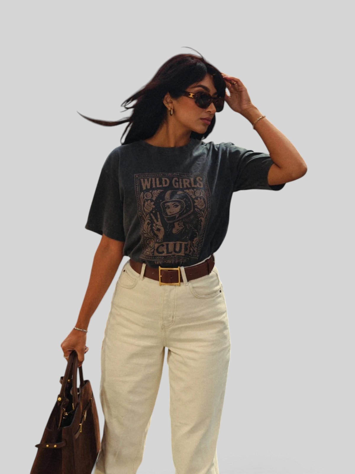 Baffle Haus Wild Girls Club grey washed cotton t-shirt with retro biker graphic print worn by a woman in cream jeans