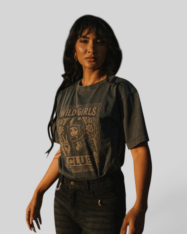 Baffle Haus grey washed cotton t-shirt with retro biker-inspired Wild Girls Club graphic print on a female model